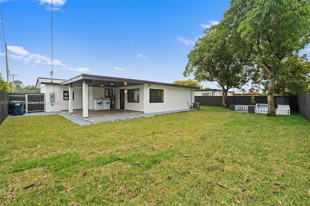 2814 SW 92nd Ct, Miami, FL 33165 - rear view of house featuring a patio, a yard, and central AC