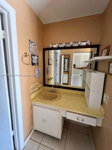 bathroom featuring tile patterned floors and vanity