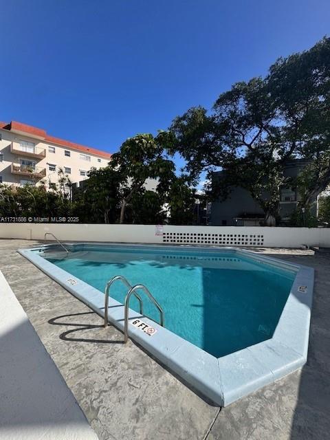 view of swimming pool featuring a patio area