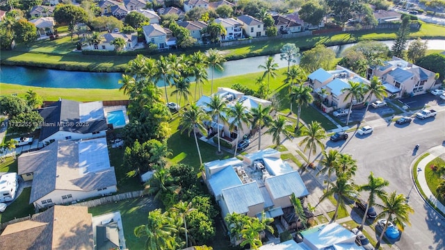 birds eye view of property featuring a water view and a residential view