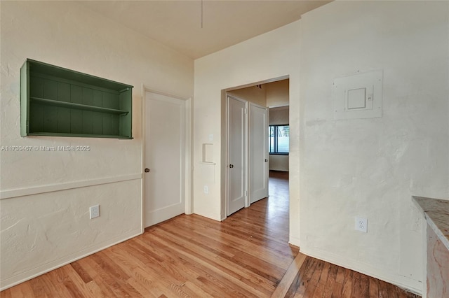 unfurnished room with light hardwood / wood-style floors