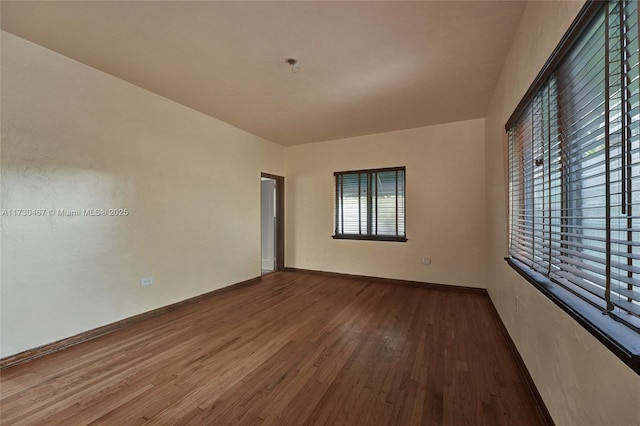 spare room with wood-type flooring