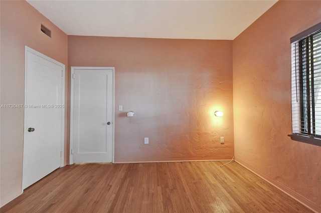 empty room featuring light hardwood / wood-style floors