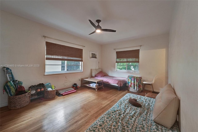 bedroom featuring hardwood / wood-style flooring and ceiling fan