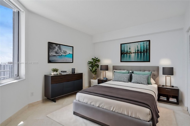 bedroom with light tile patterned floors