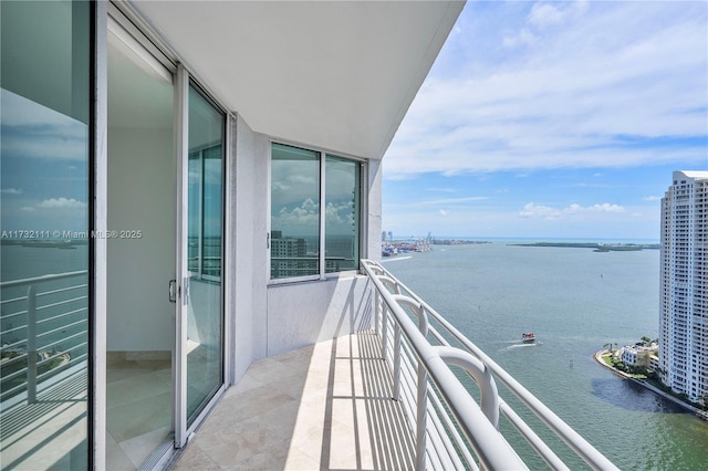 balcony featuring a water view