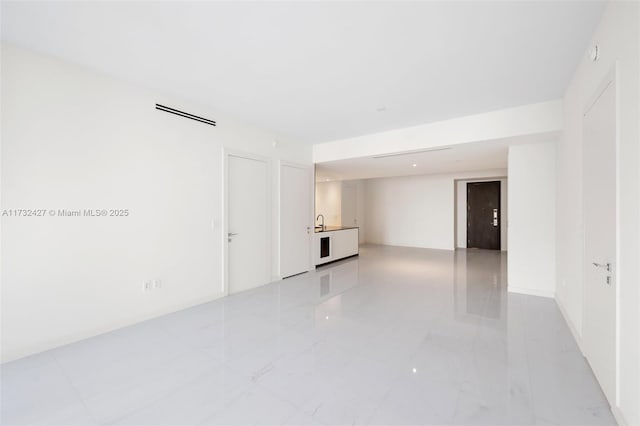 empty room featuring marble finish floor