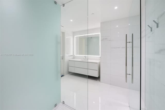 full bath featuring tile patterned floors, an enclosed shower, vanity, and recessed lighting