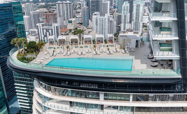 view of pool featuring a view of city