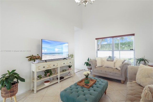 living room featuring light tile patterned floors and a towering ceiling