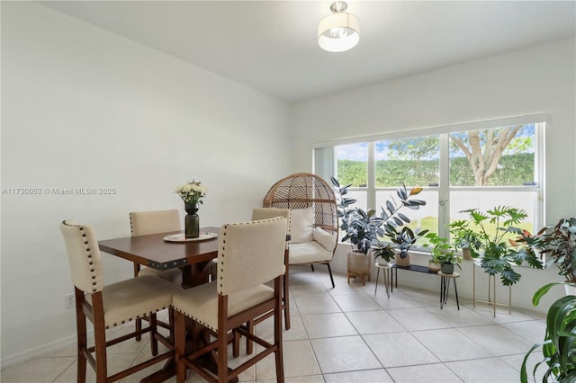 dining room with light tile patterned flooring