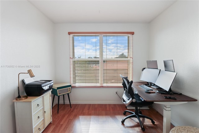 office space with light wood-type flooring