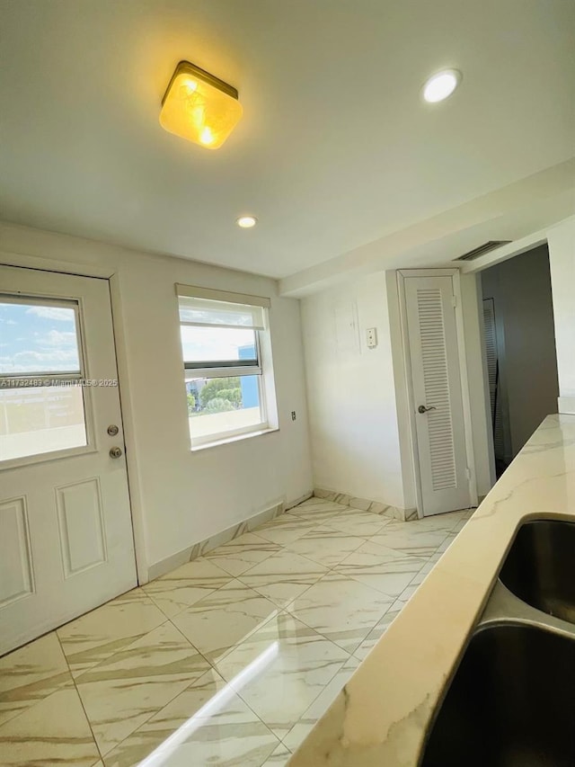 interior space featuring sink and a wealth of natural light