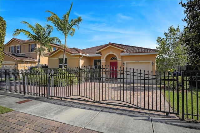 mediterranean / spanish house with a garage