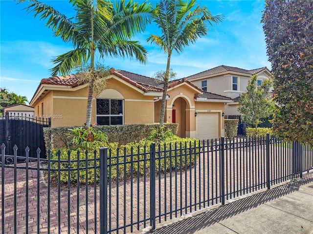 mediterranean / spanish-style home with a garage