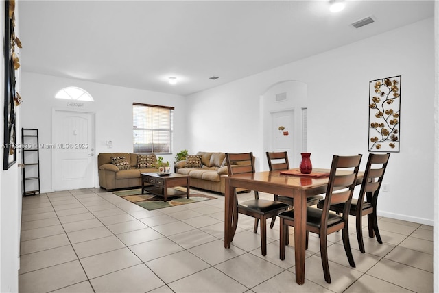 dining area featuring light tile patterned floors