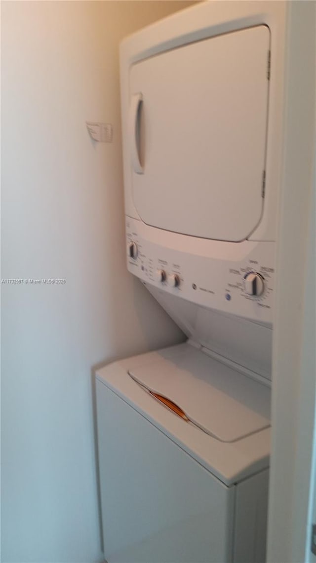 laundry room featuring stacked washer and dryer