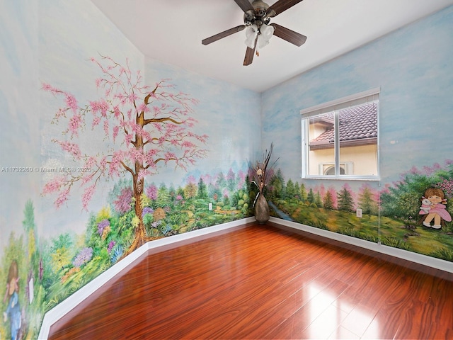 unfurnished room featuring ceiling fan and wood-type flooring