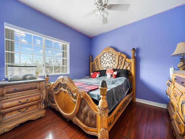 bedroom with dark wood-type flooring and ceiling fan