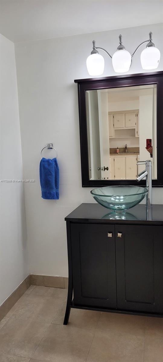 bathroom featuring vanity and tile patterned flooring