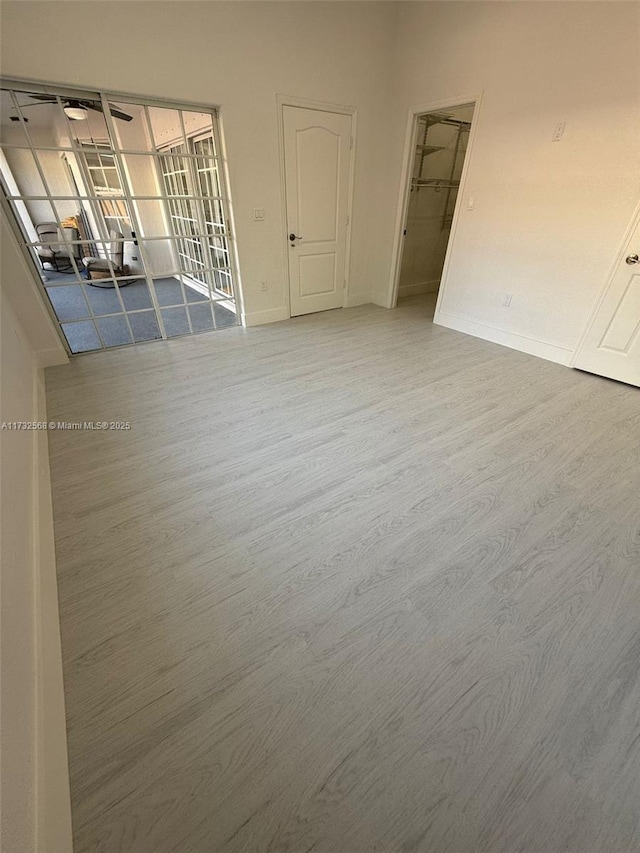 spare room featuring wood-type flooring