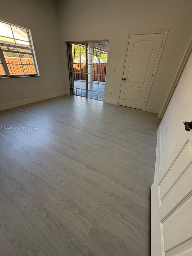 spare room with light hardwood / wood-style floors