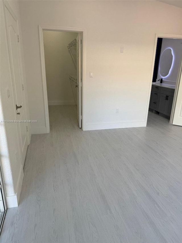 spare room featuring light hardwood / wood-style flooring