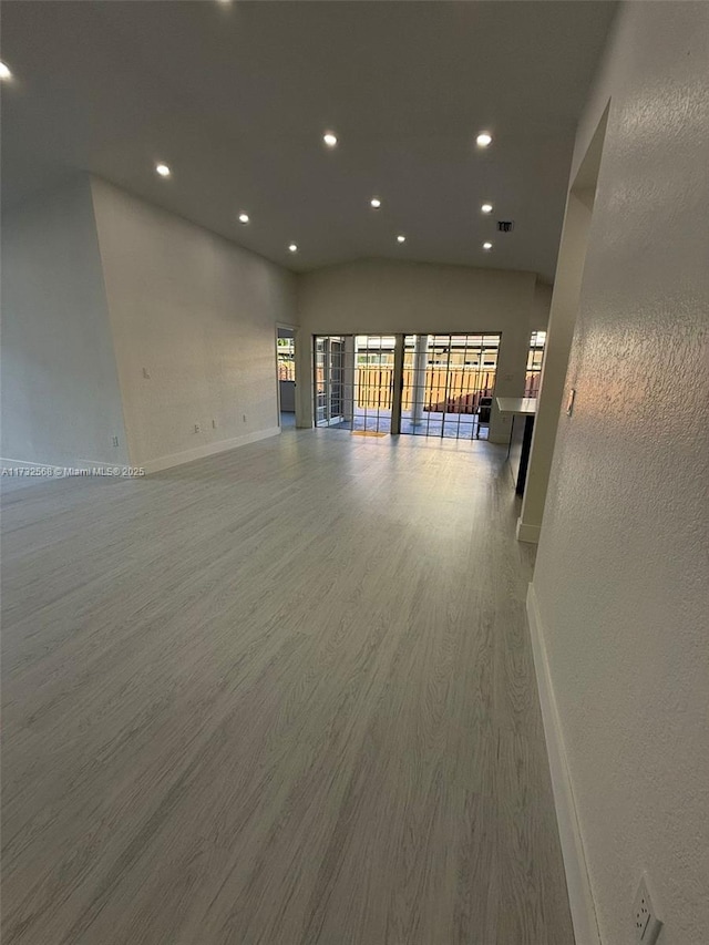 spare room with wood-type flooring