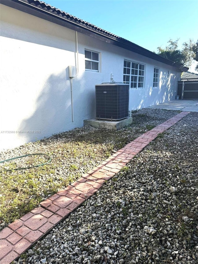 view of side of home with cooling unit