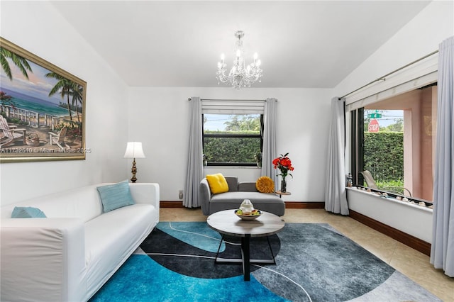 tiled living room featuring vaulted ceiling, a healthy amount of sunlight, and an inviting chandelier