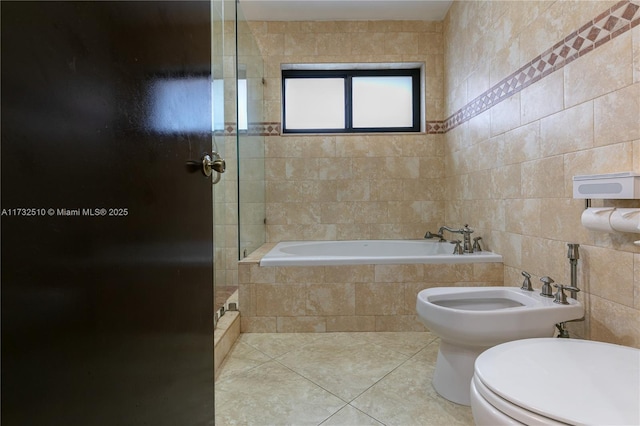 full bathroom featuring tile walls, toilet, a tile shower, tiled tub, and tile patterned floors