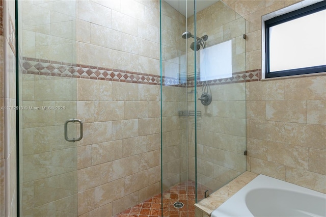 full bath with a shower stall and a bath