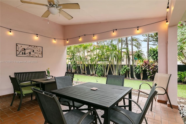 exterior space featuring a ceiling fan, outdoor dining area, and a fenced backyard