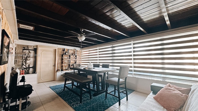 interior space with beamed ceiling and ceiling fan