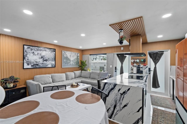 dining space with wooden walls