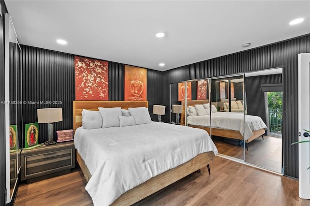 bedroom with hardwood / wood-style floors