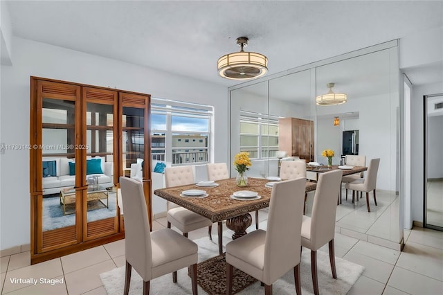 dining area featuring light tile patterned floors