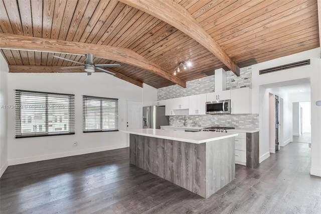 kitchen featuring wooden ceiling, stainless steel appliances, a center island, and white cabinets