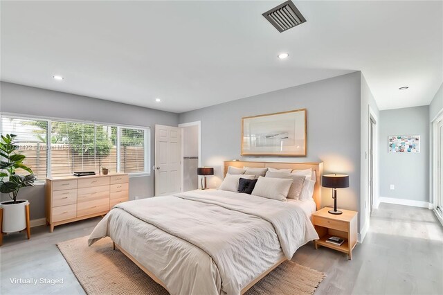 unfurnished room with light wood-type flooring