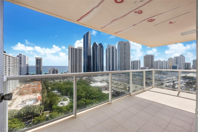 balcony featuring a water view