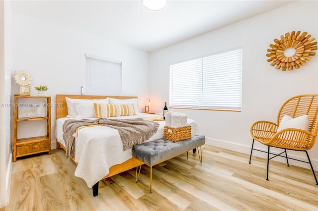 bedroom with light wood-type flooring