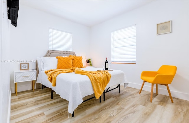 bedroom with light hardwood / wood-style flooring