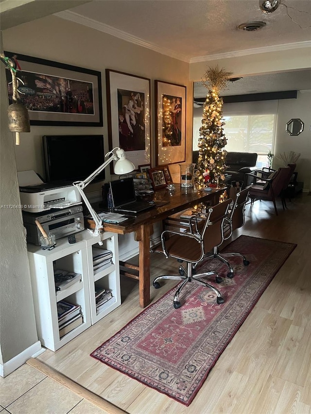 home office featuring ornamental molding and light wood-type flooring