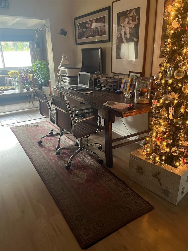 home office with hardwood / wood-style floors