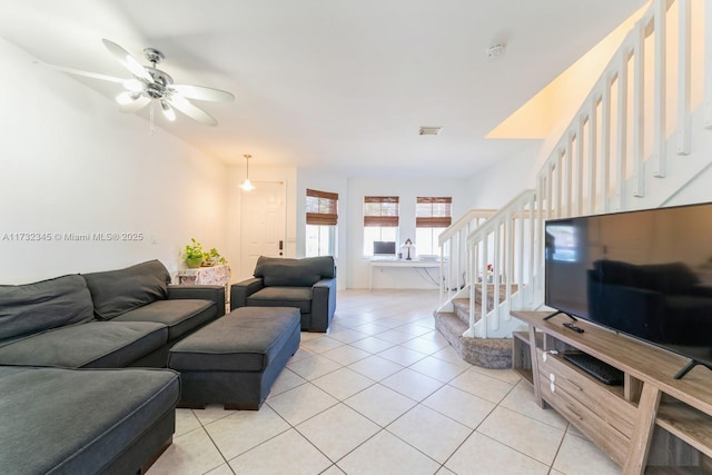 tiled living room featuring ceiling fan