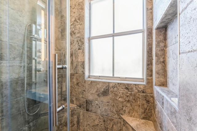 bathroom with an enclosed shower