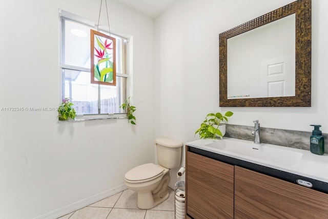 bathroom with tile patterned floors, toilet, and vanity