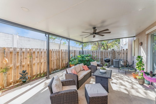 sunroom / solarium with ceiling fan