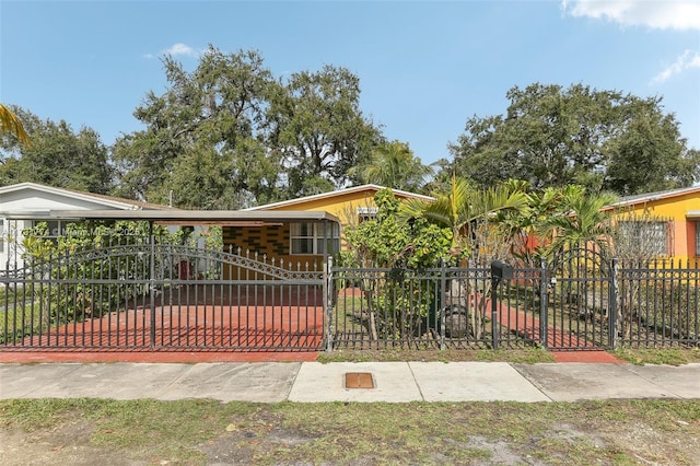 view of gate featuring a carport