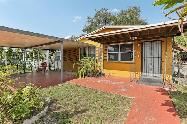 exterior space with a carport